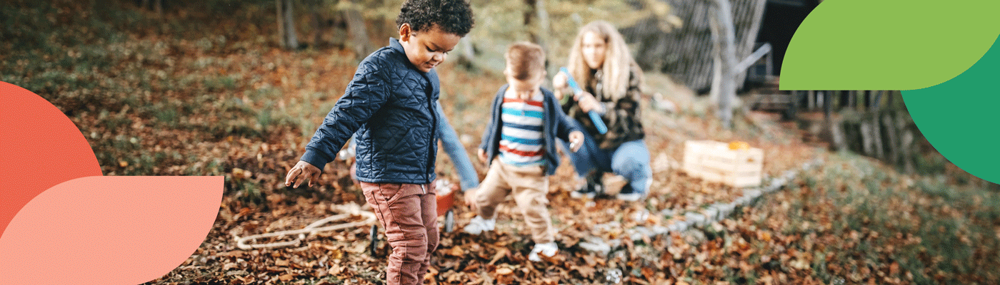 A parent and two children taking a nature walk