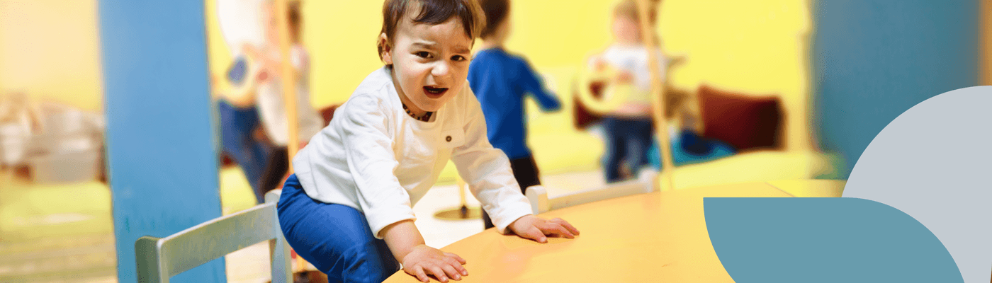 Child taking a seat at a table